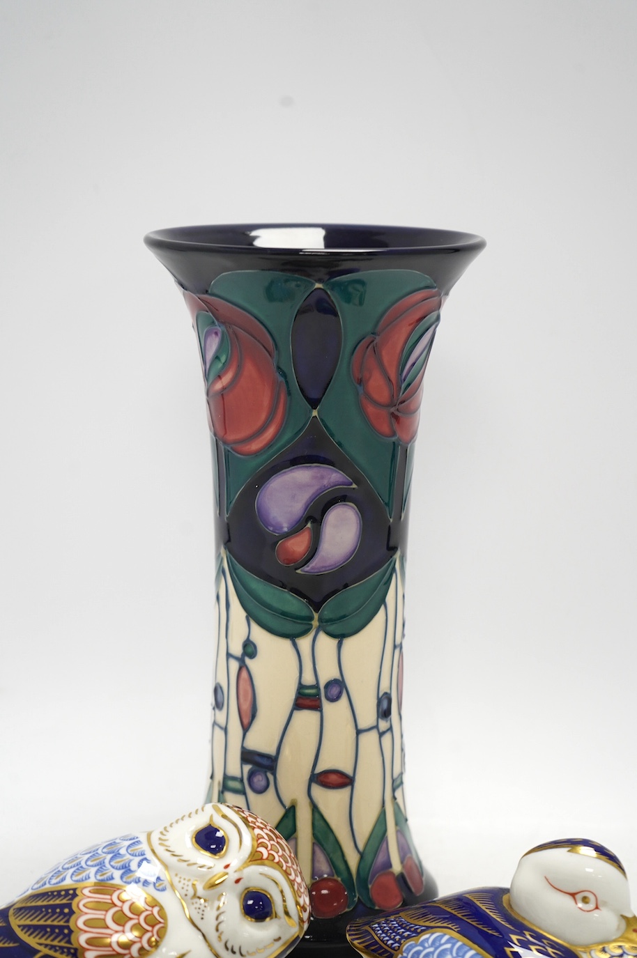 A Moorcroft vase, two Moorcroft design enamel boxes and two Crown Derby birds, vase 25cm. Condition - good